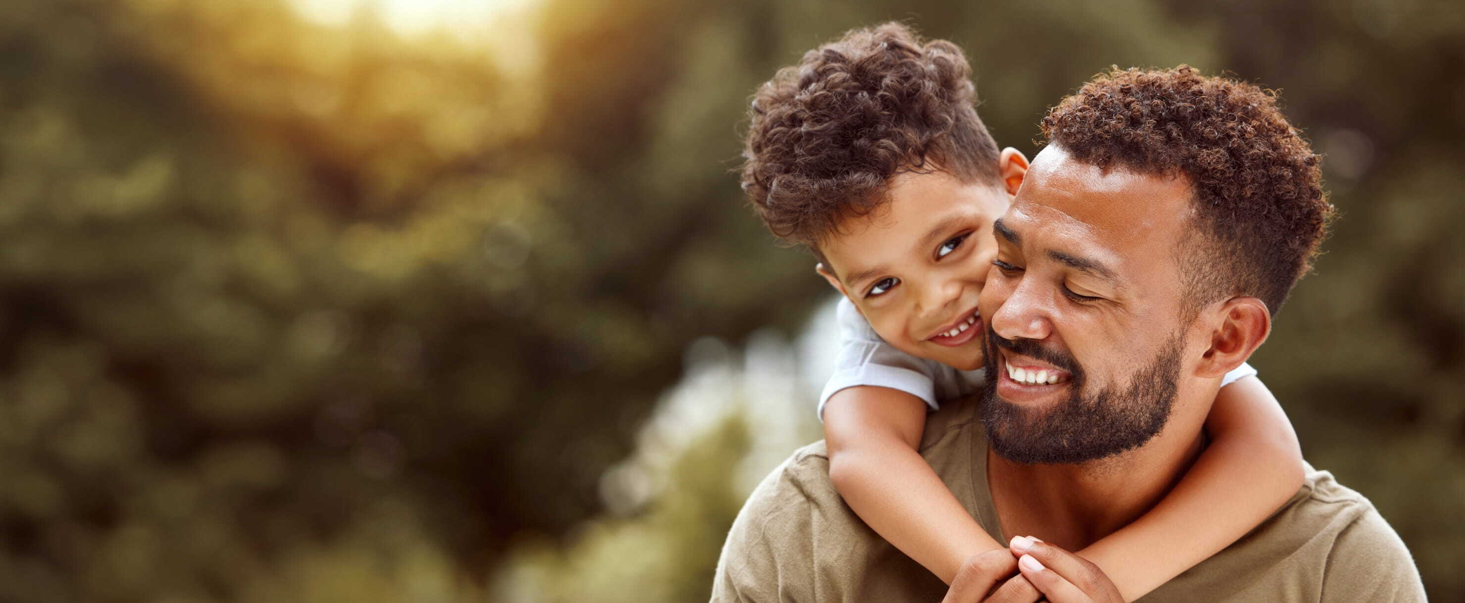 Father and son smiling