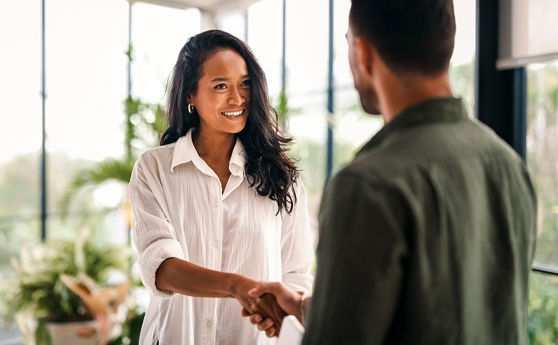 Man and woman shaking hands