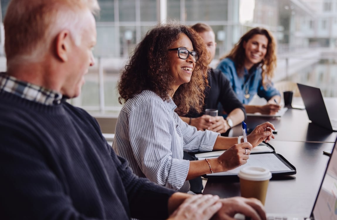 People in meeting smiling