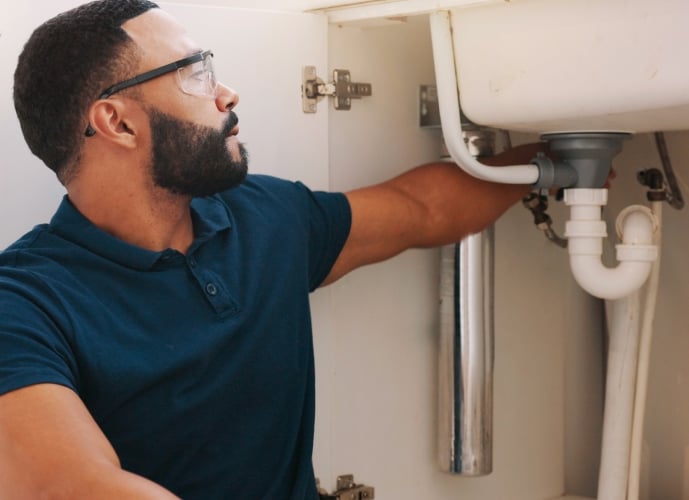 Man fixing sink