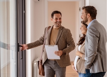 Buyers walking around new house