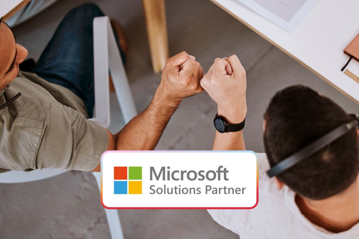 Two-People-Bumping-Fists-Microsoft-Partner